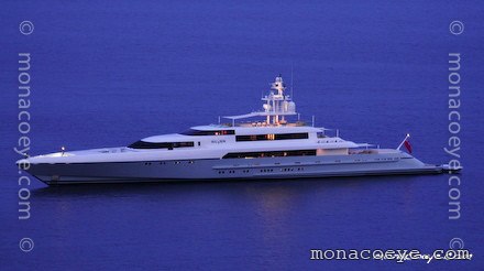 Silver yacht at night