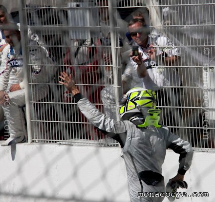 Jenson Button congratulated by rival teams